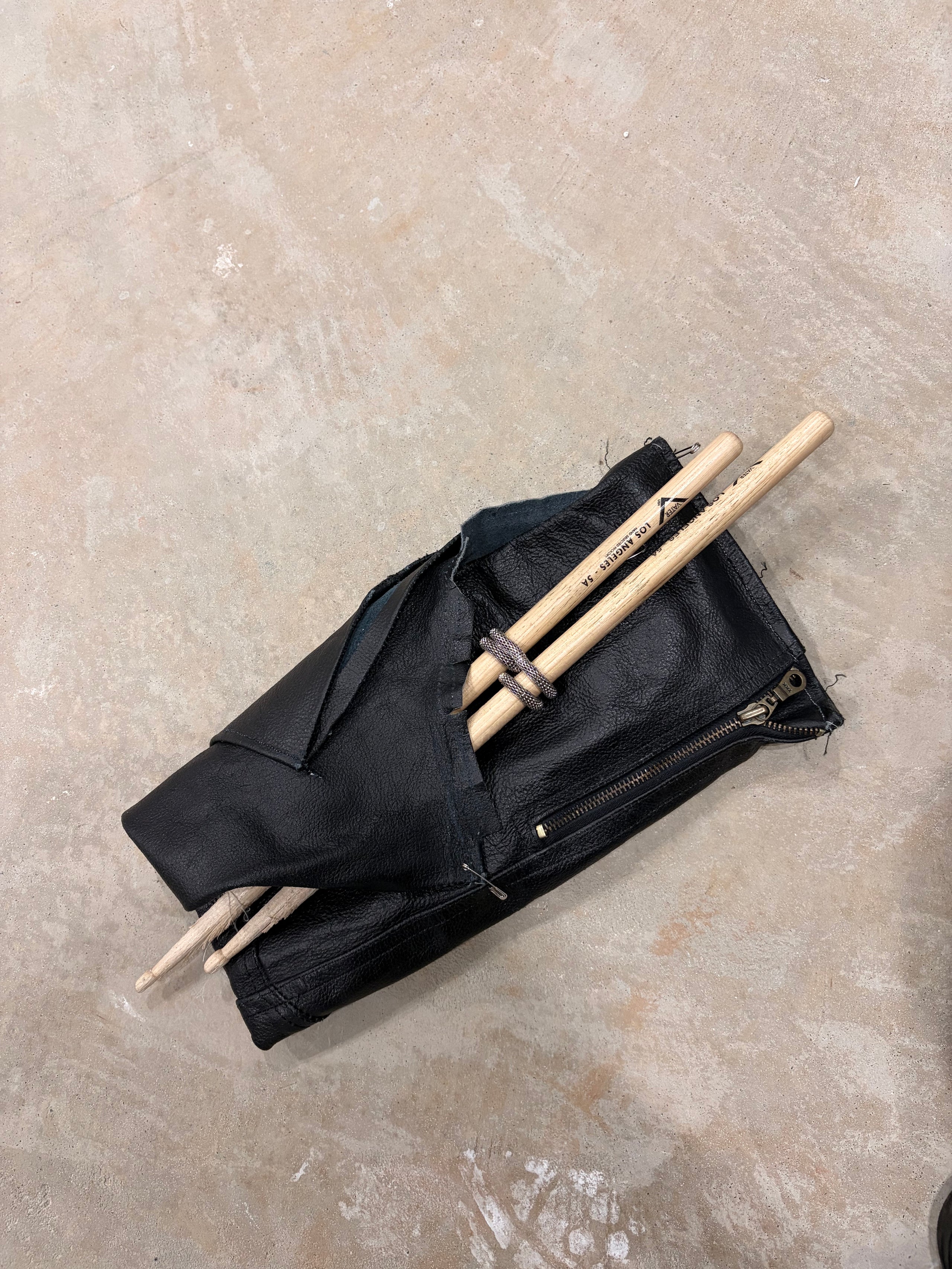 Leather sleeve drummer clutch